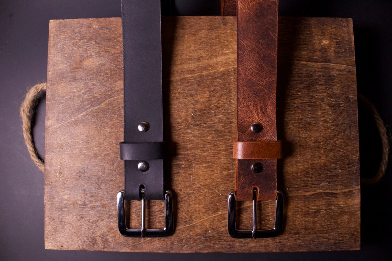 2 women leather belts, black and brown, top view