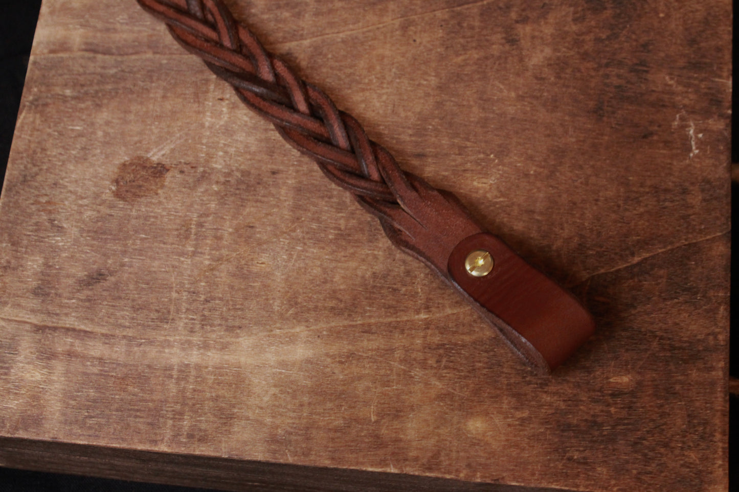 Brown Braided Leather Gun Sling, brown braided leather gun strap, top view, top end - braided leather rifle sling - braided leather rifle strap for hunting