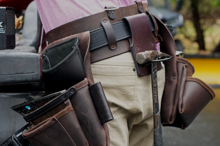 brown leather tool belt, back view on person