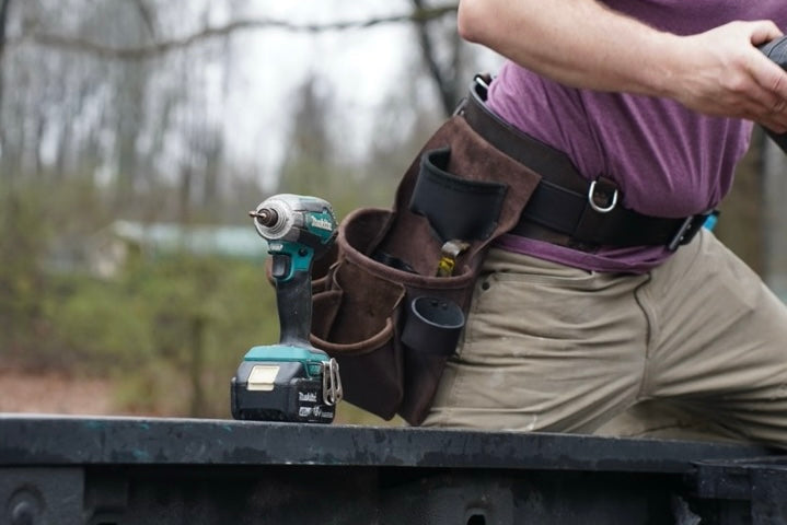 brown leather tool belt, front view on person